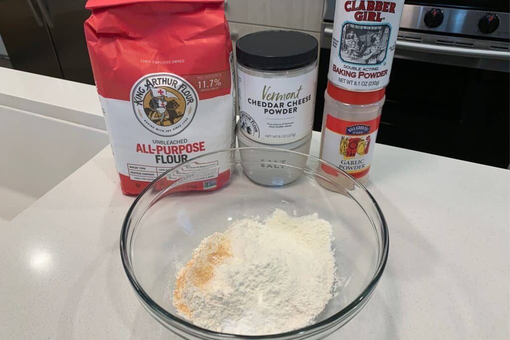 all purpose flour, cheddar powder, salt, baking powder, and garlic powder in a mixing bowl