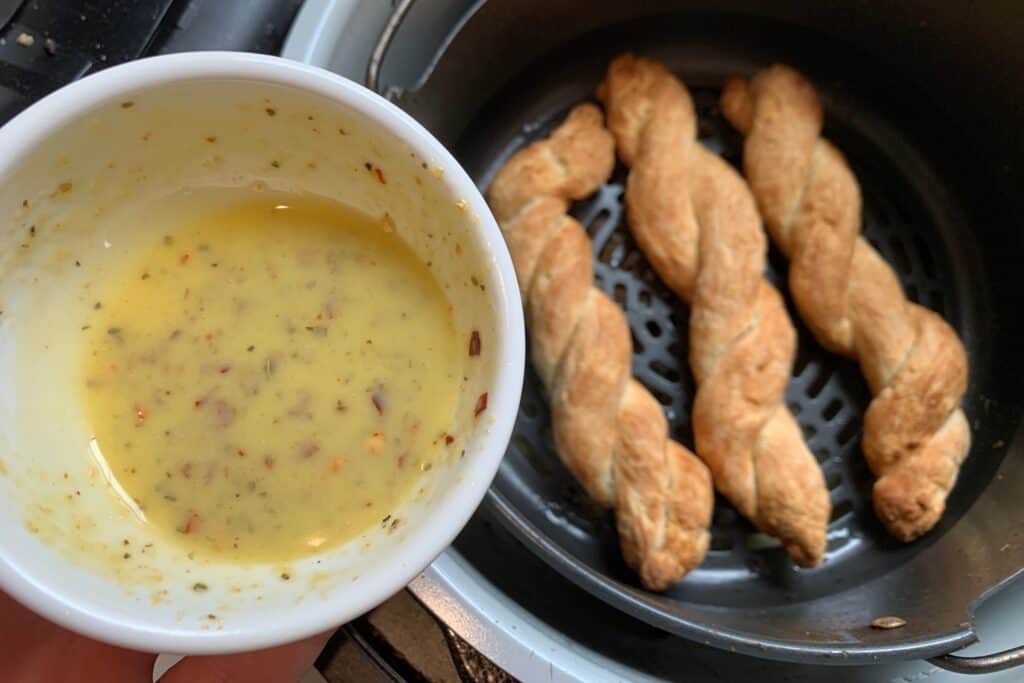 the butter sauce in a small bowl before brushing on the cooked bread twists