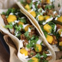 two Brushfire tacos in a basket