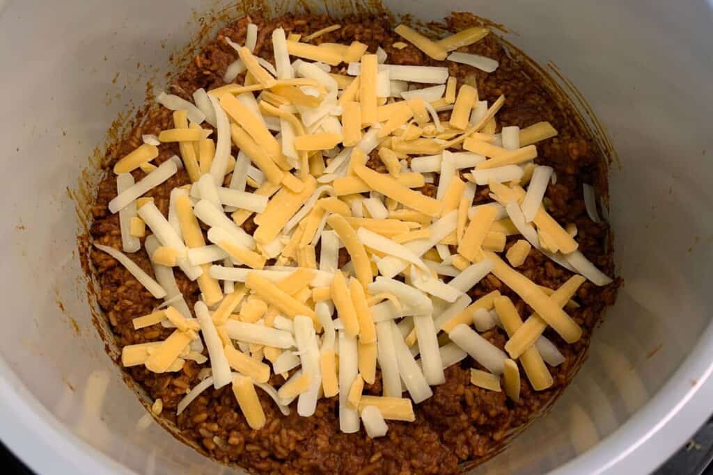 shredded cheese added to the cooked rice and ground beef in the ninja foodi pot