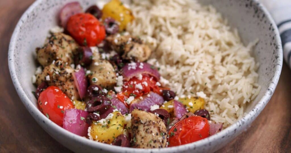 greek chicken and vegetables with feta cheese and kalamata olives