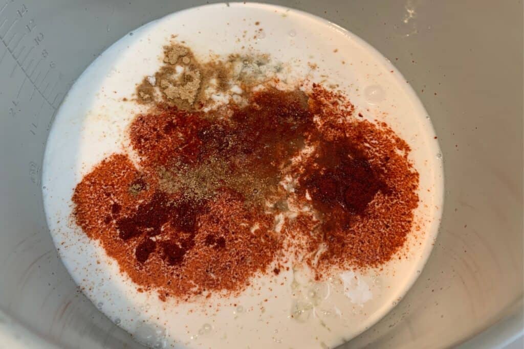 lite coconut milk, honey, gochujang, lime juice, and spices in a pressure cooker pot
