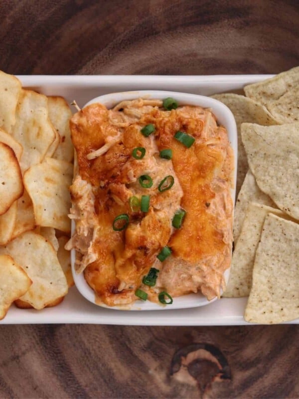buffalo chicken dip in a bowl with chips and crackers