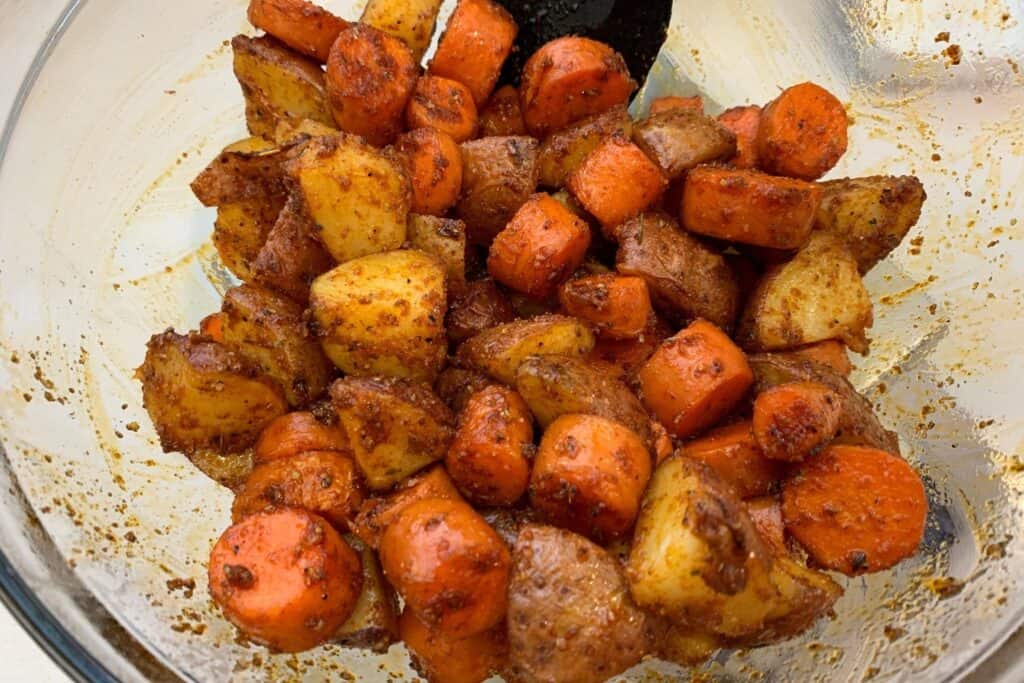 potatoes and carrots with seasoning before air frying the second time
