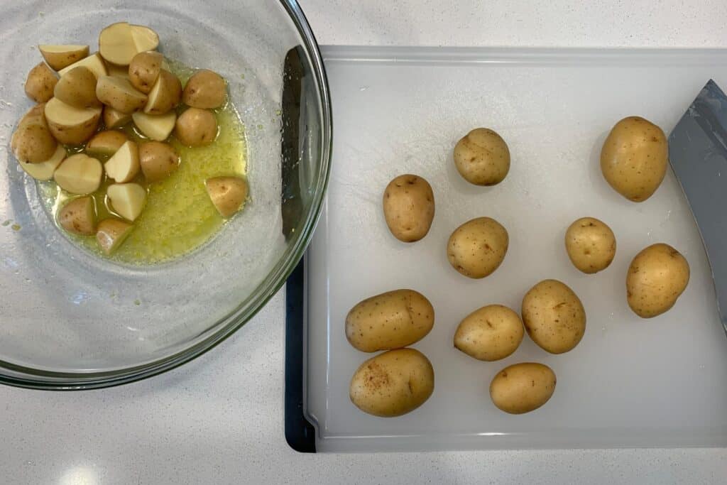quartered baby gold potatoes in lemon juice and olive oil