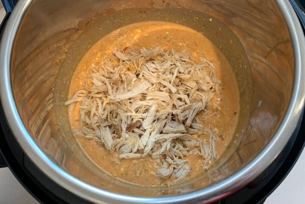 shredded chicken in the Instant Pot with creamy buffalo sauce