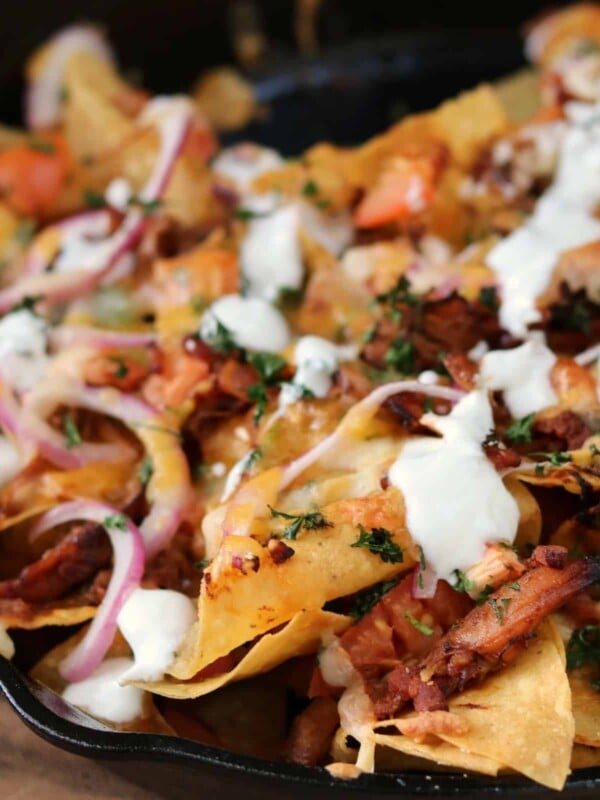 cast iron skillet with BBQ chicken nachos