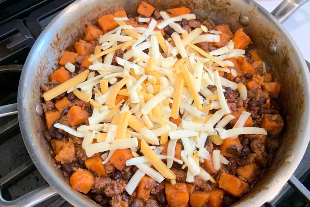 shredded cheese on the sweet potato skillet before broiling in the oven