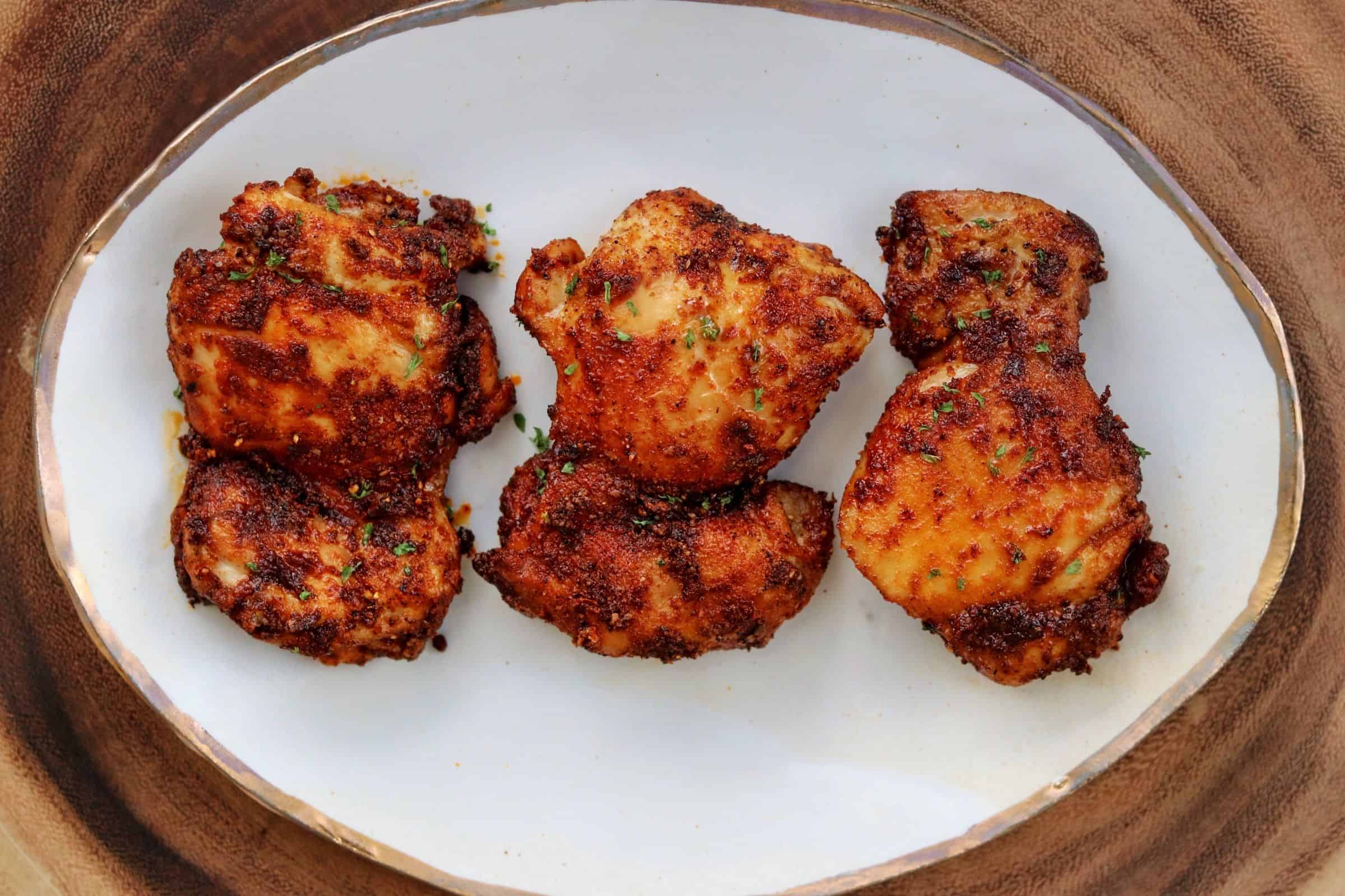 3 buffalo chicken thighs on a plate