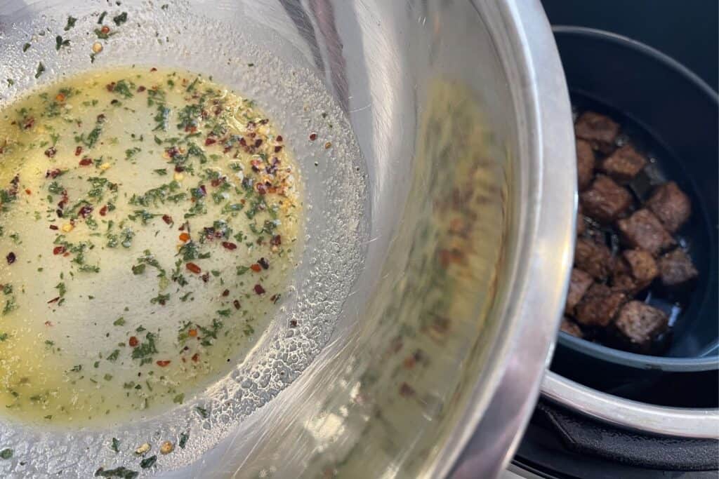 garlic butter before tossing with air fried steak bites