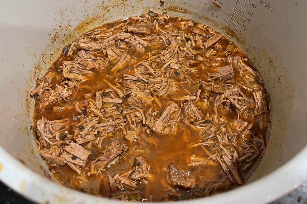 shredded beef in the juices