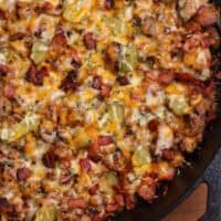 cast iron skillet with cheeseburger ground beef and radishes