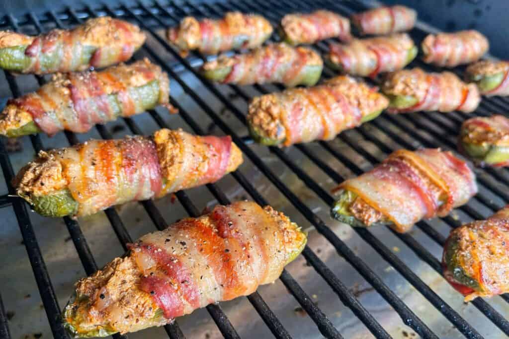 bacon wrapped jalapeno poppers in the Traeger grill