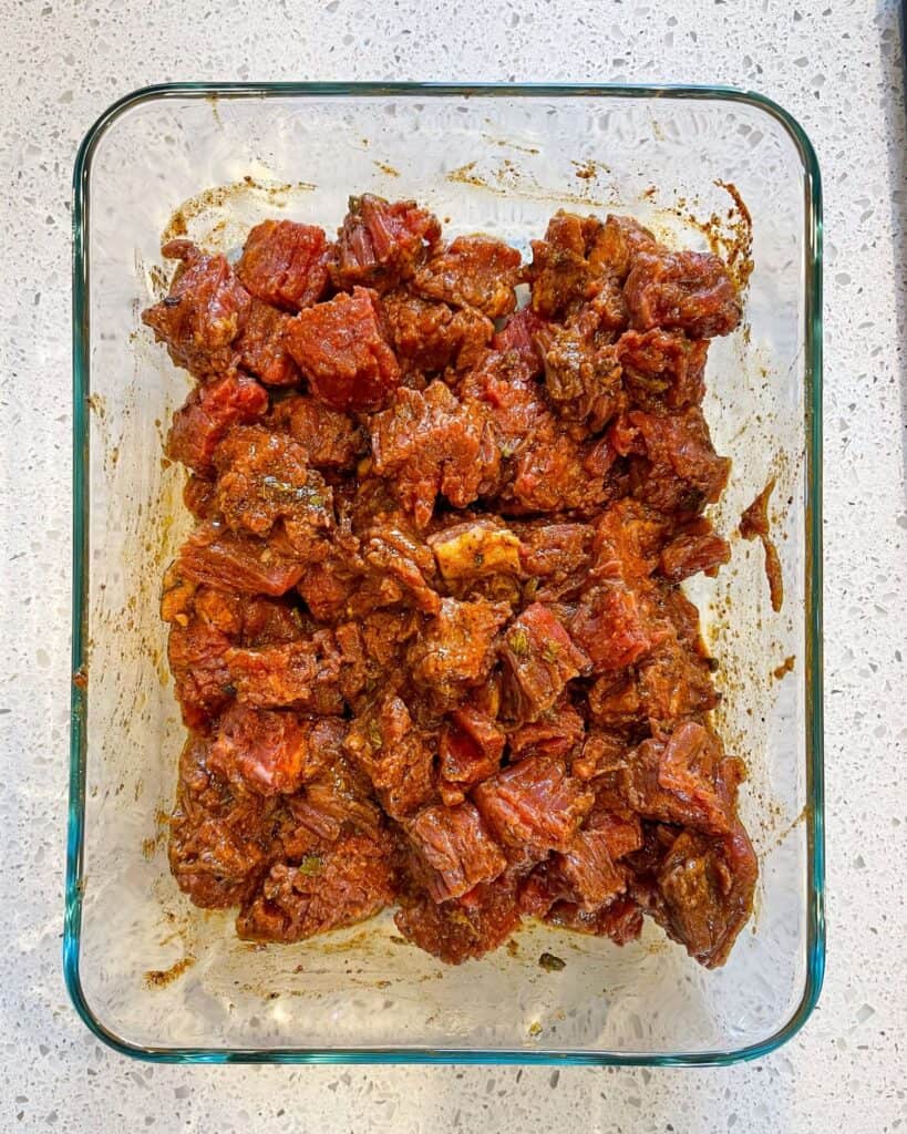 marinated flank steak in a resealable container