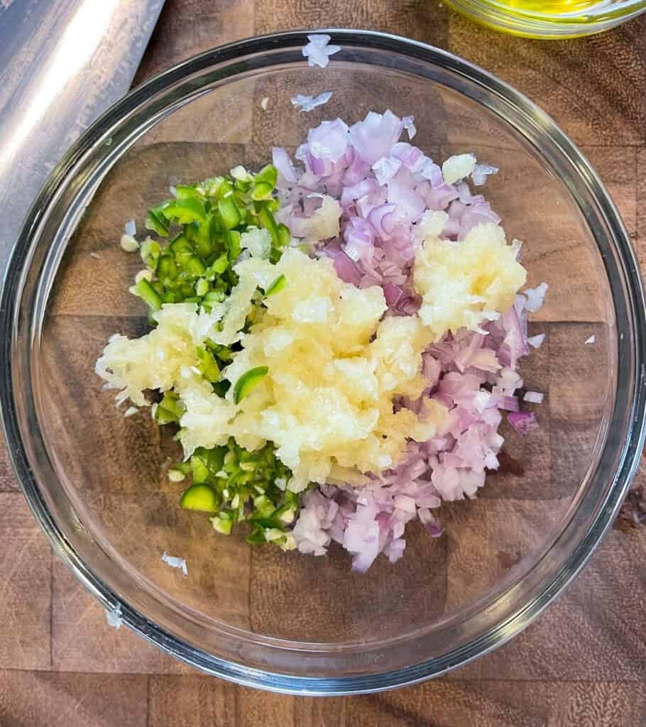 grated garlic, minced shallots, and minced serrano pepper in a small bowl
