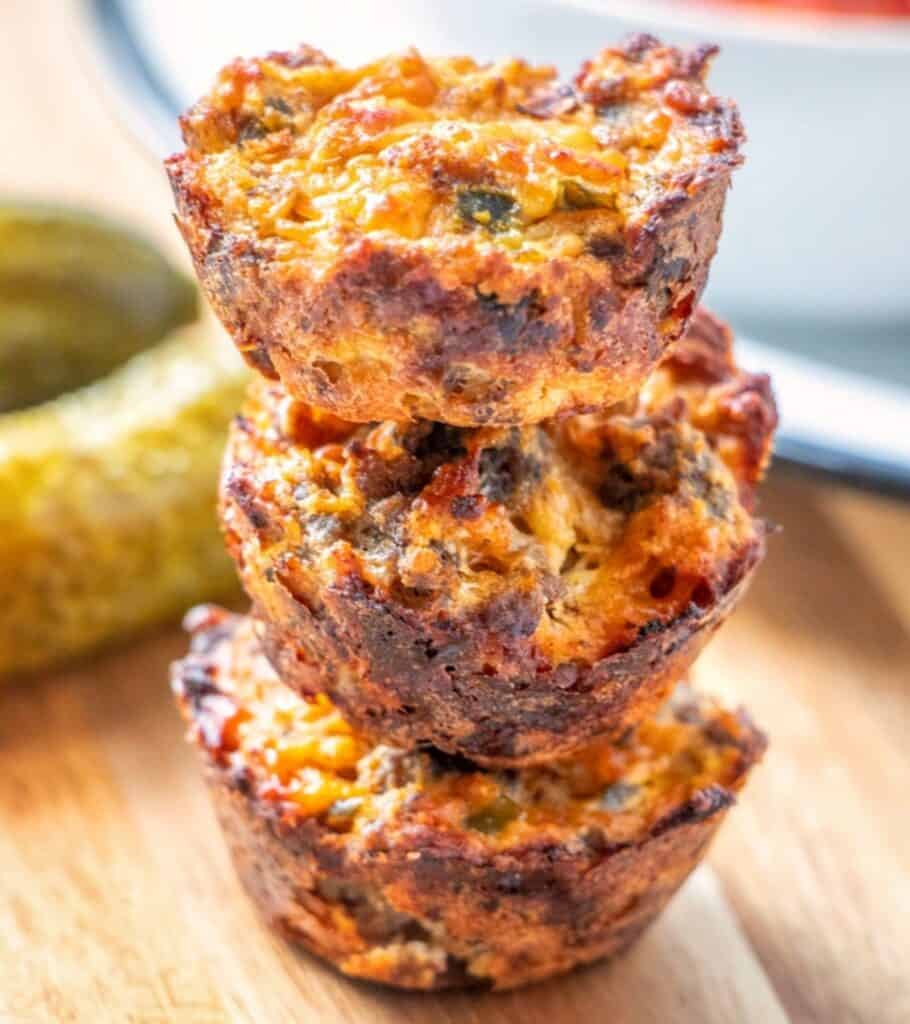 three cheeseburger muffins stacked on top of one another