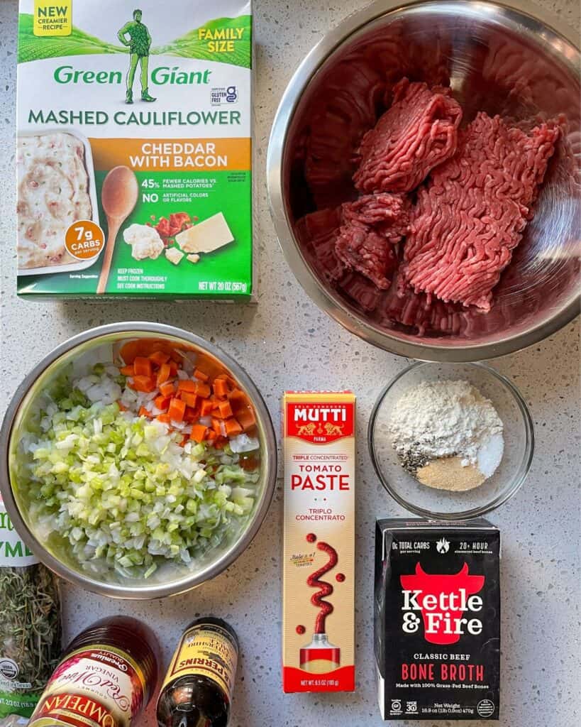 frozen mashed cauliflower, ground beef, and ingredients for cottage pie