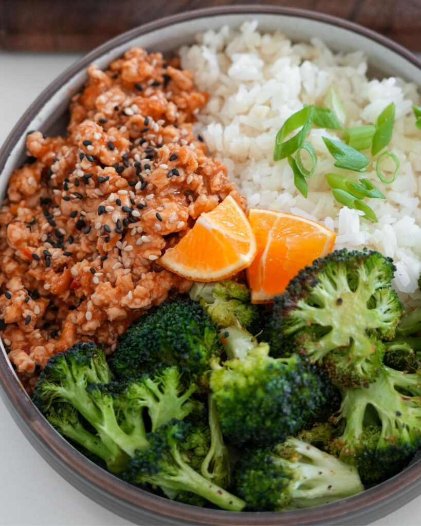 bowl of ground chicken with broccoli and rice