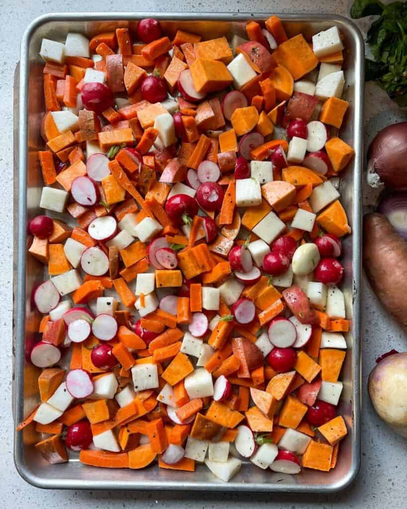 chopped root vegetables on a sheet pan