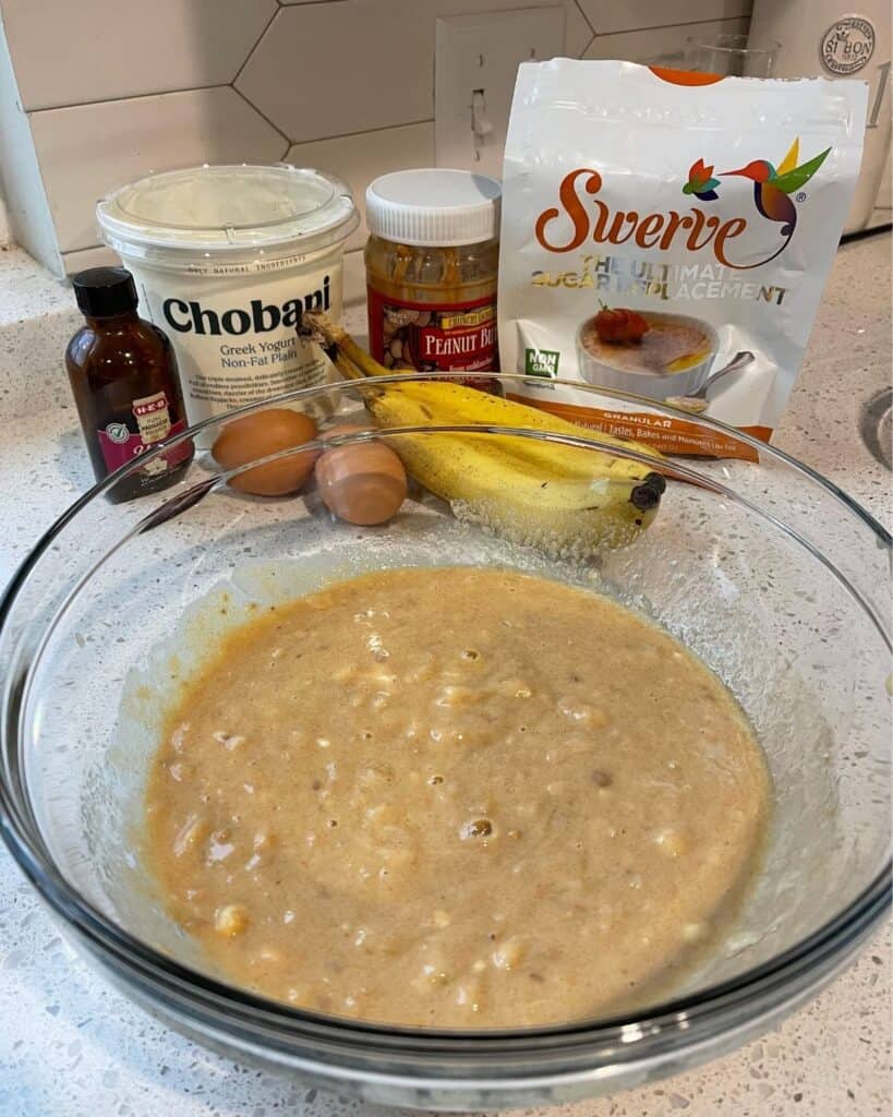 vanilla extract, fat free Greek yogurt, mashed banana, eggs, crunchy peanut butter, and granulated swerve in a mixing bowl