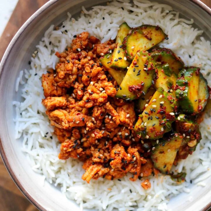 bowl of rice topped with Korean ground turkey and cucumber kimchi