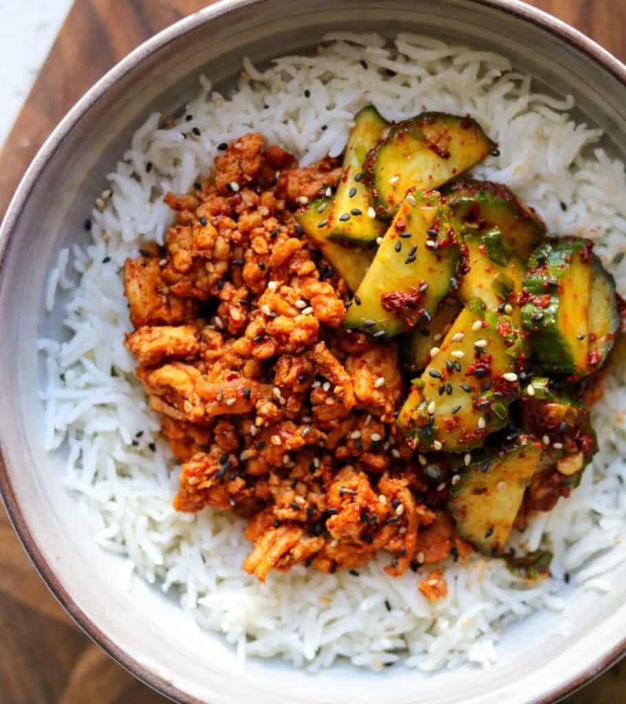 bowl of rice topped with Korean ground turkey and cucumber kimchi