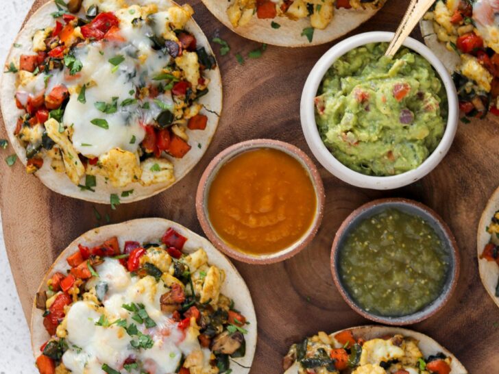 baked tostadas topped with egg whites, veggies, and cheese