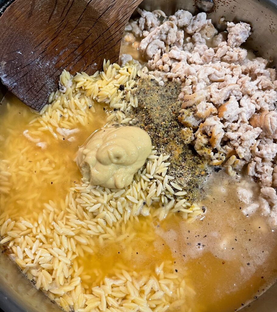 chicken broth and dijon mustard added to the skillet