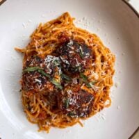 3 Italian chicken meatballs with protein spaghetti in a pasta bowl