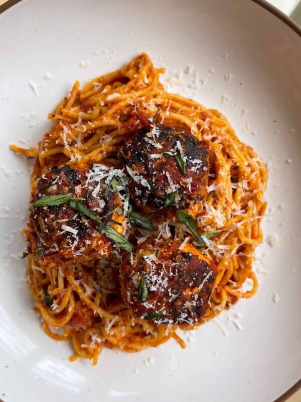 3 Italian chicken meatballs with protein spaghetti in a pasta bowl