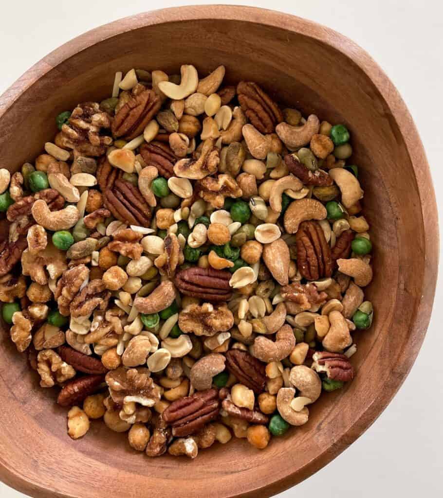 mixed nuts and seeds in a wooden bowl