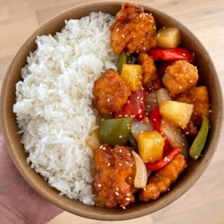 air fried sweet and sour chicken with toasted sesame seeds and rice