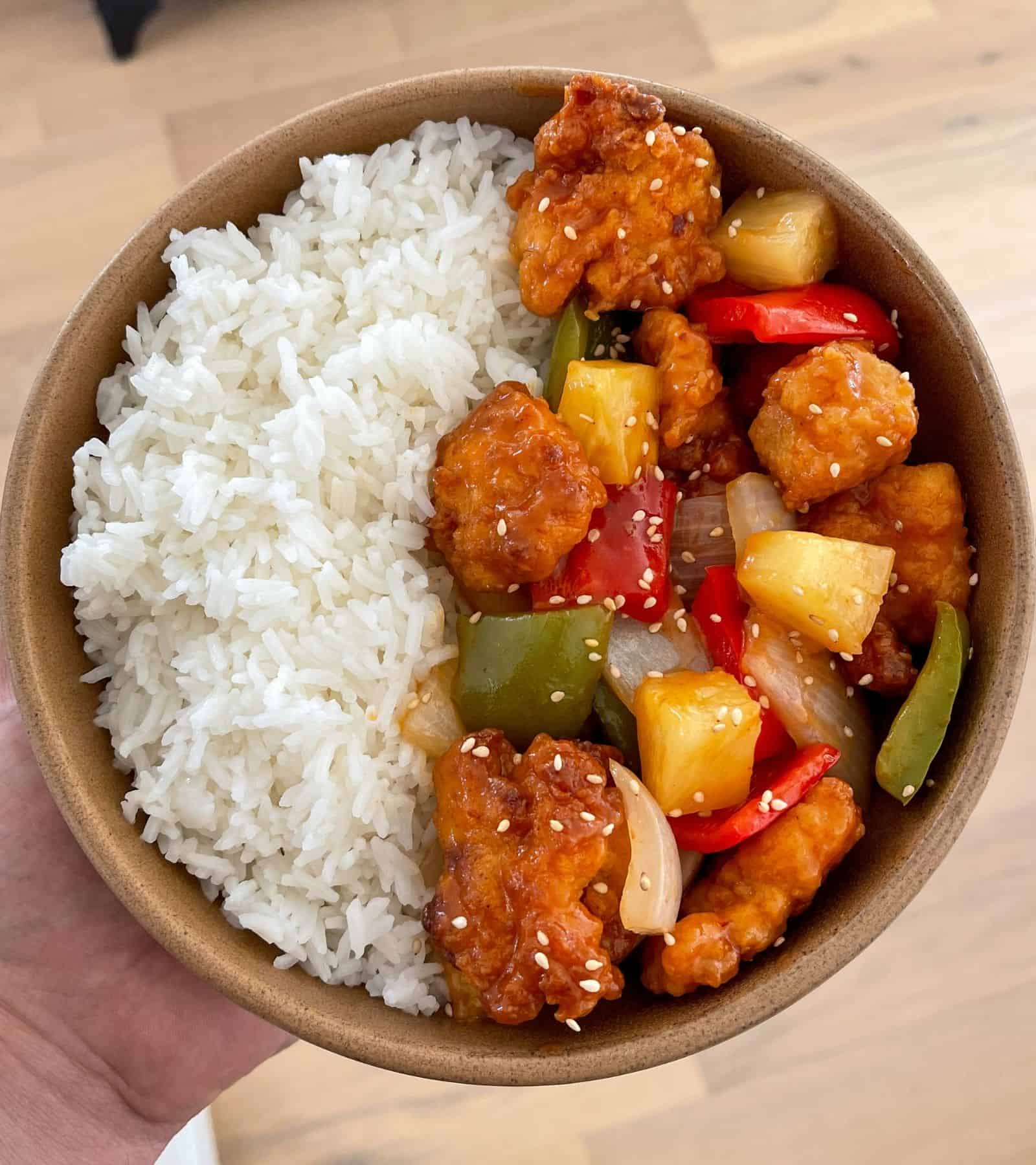air fried sweet and sour chicken with toasted sesame seeds and rice