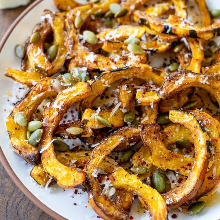 air fried delicata squash strips with honey, pumpkin seeds, chile flakes, and parmesan