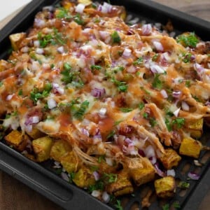 air fryer roasted butternut squash topped with pulled rotisserie chicken, cheese, red onion, jalape&ntilde;o, and bbq sauce