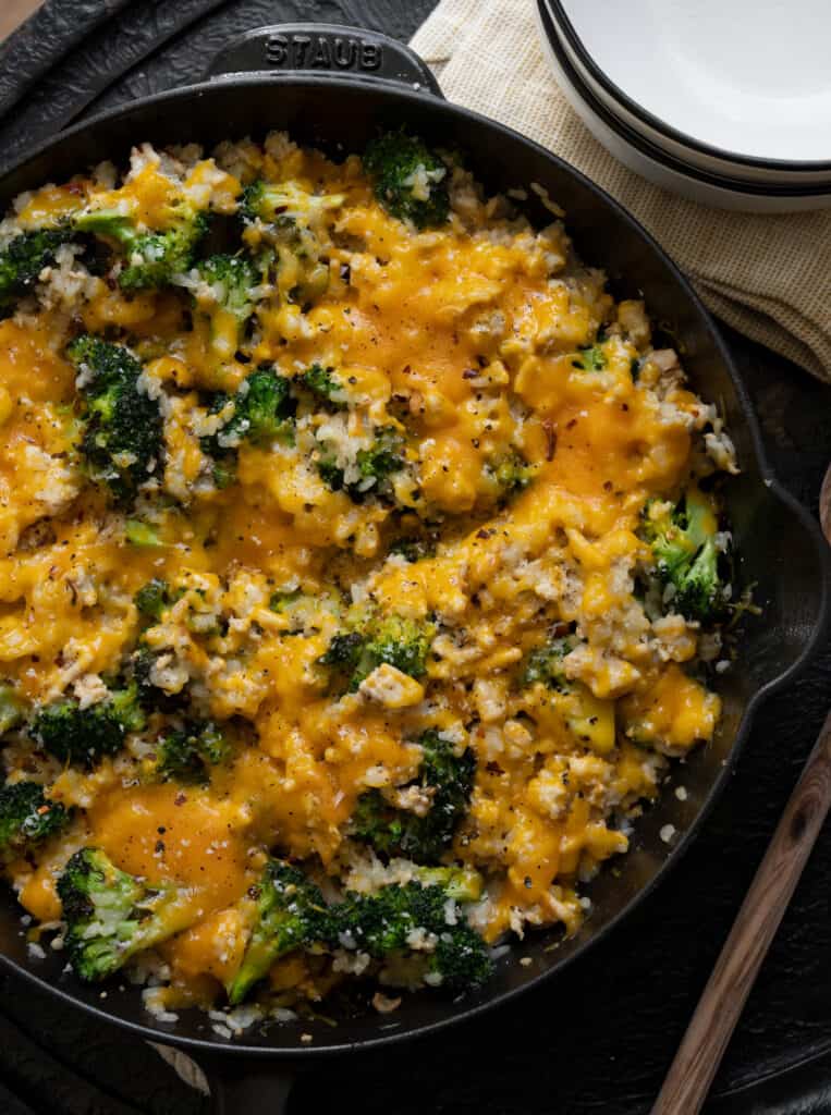 cheesy ground chicken and rice casserole in a cast iron skillet