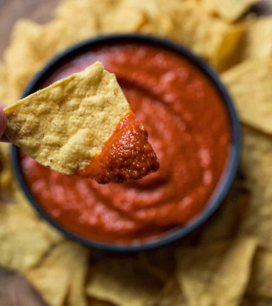 tortilla chip dipped in a chipotle smoked salsa