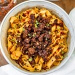 noodle bowl topped with firecracker ground beef and chives