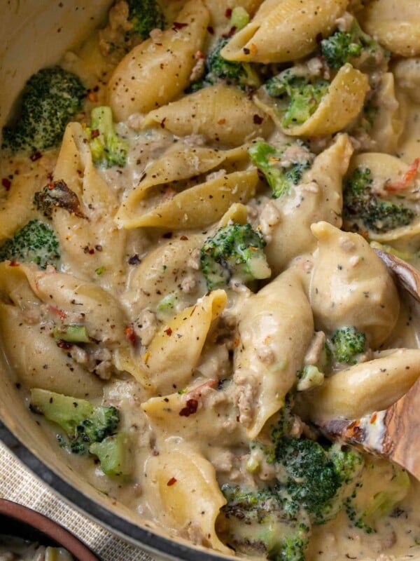 ground turkey pasta shells in a pot with roasted broccoli and a lemon ricotta sauce