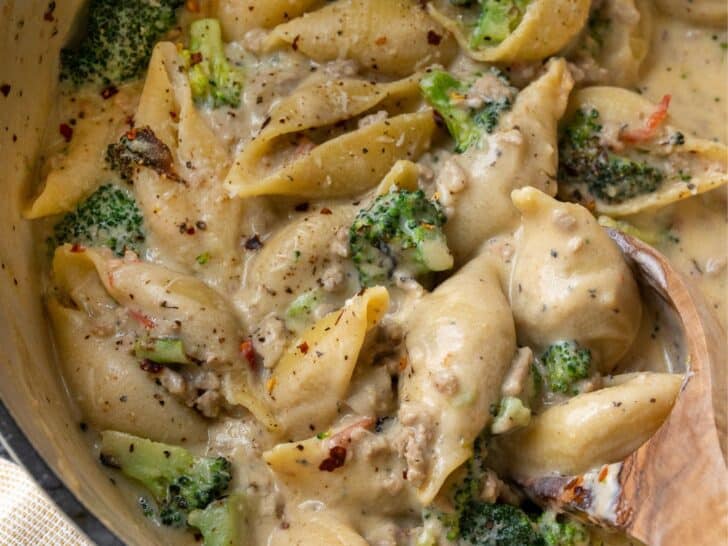 ground turkey pasta shells in a pot with roasted broccoli and a lemon ricotta sauce