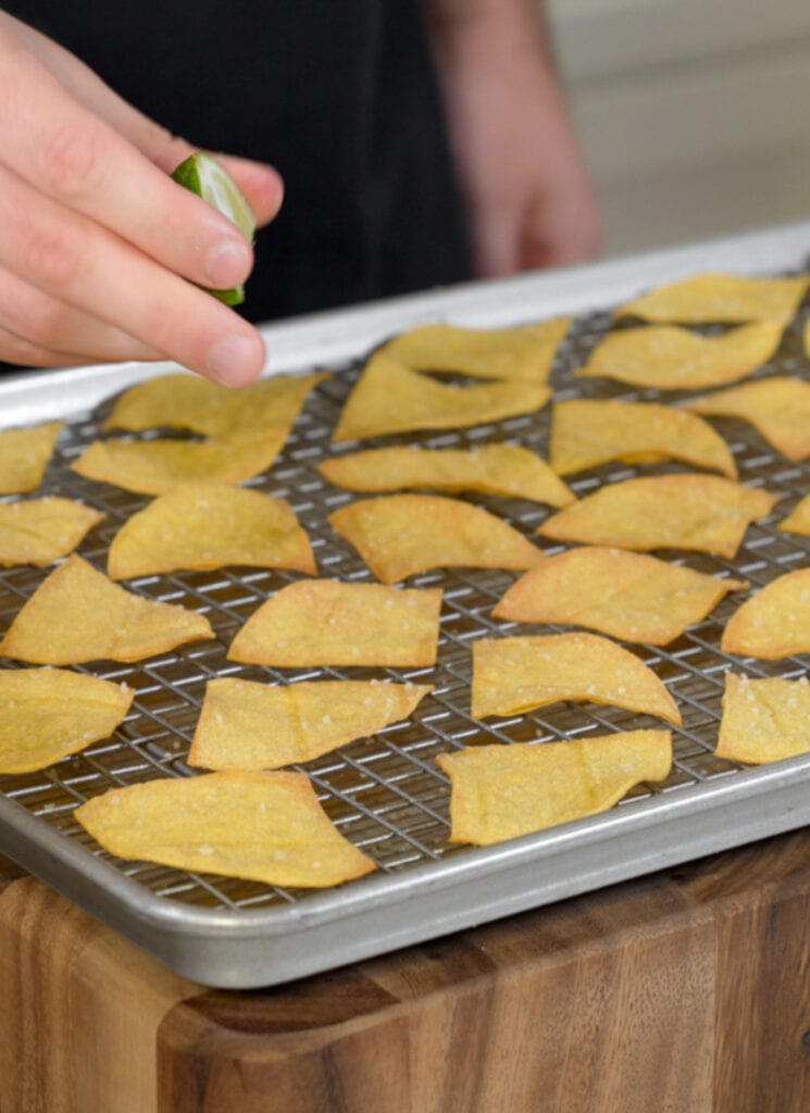 baked tortilla chips on a sheet pan