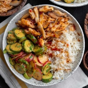 sweet chili rotisserie chicken rice bowl with cucumber crunch salad