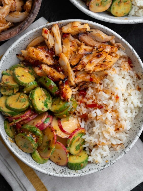 sweet chili rotisserie chicken rice bowl with cucumber crunch salad