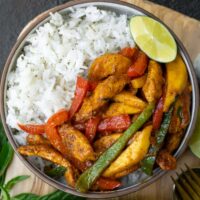 jasmine rice bowl with Thai chili chicken breast and peppers with mango and lime