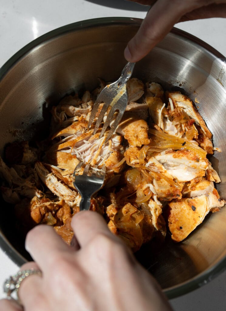 shredded slow cooked chicken with forks