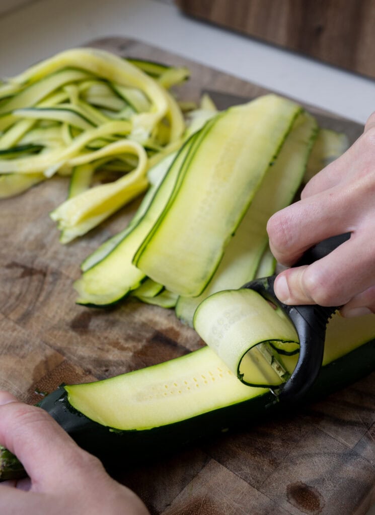 peeling zucchini to make noodles