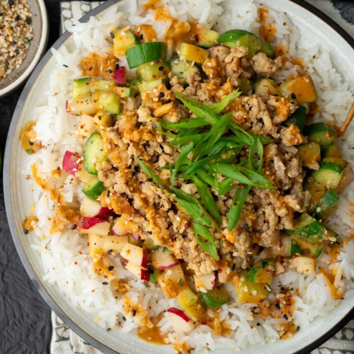 sesame ginger chicken crumbles with jasmine rice and chili tahini cucumber crunch salad