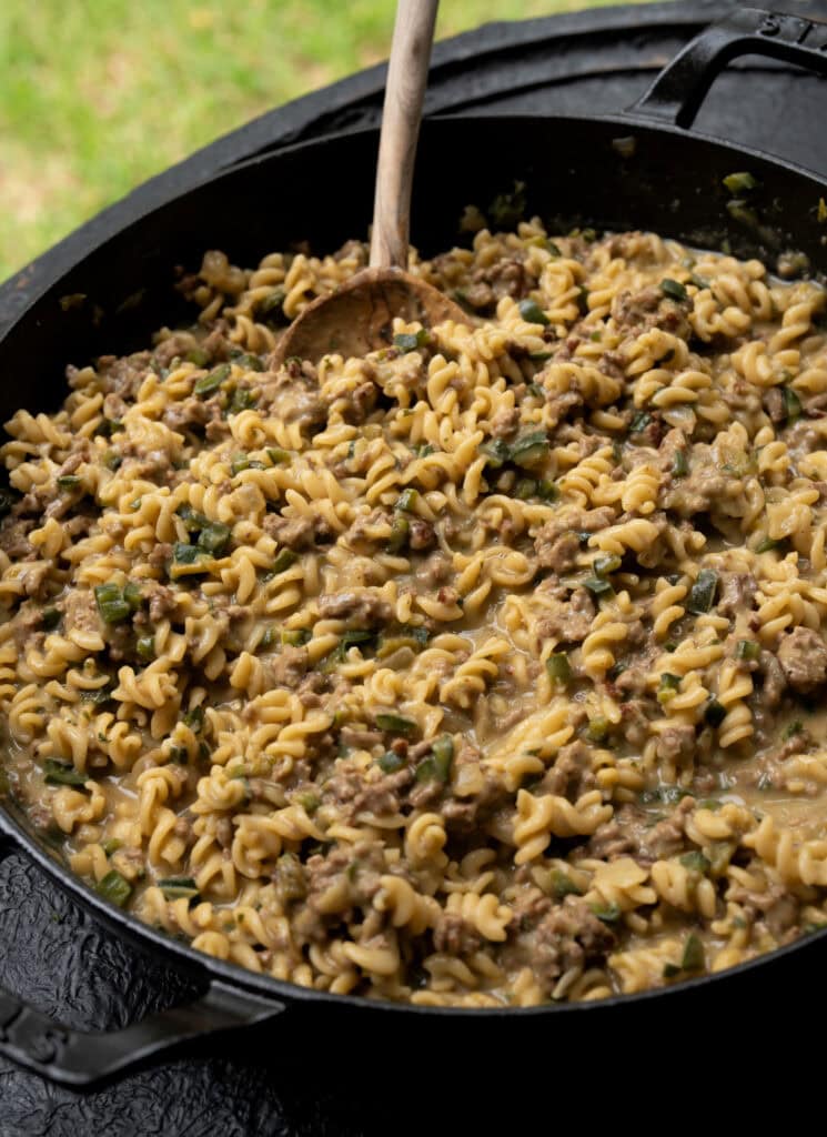 a Staub cast iron braising pan with Green chile ground beef and Goodles before serving