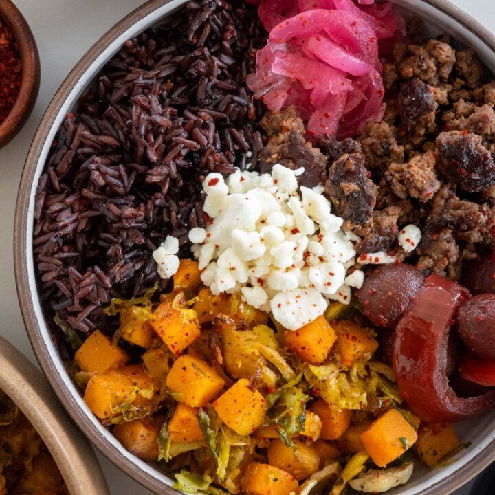 ground beef bowls with roasted butternut squash and shaved brussels sprouts, forbidden rice, goat cheese, pickled beets and onions