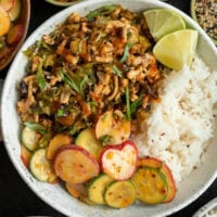 Thai sweet chili ground turkey and brussels sprouts bowls with jasmine rice, cucumber salad, and lime wedges